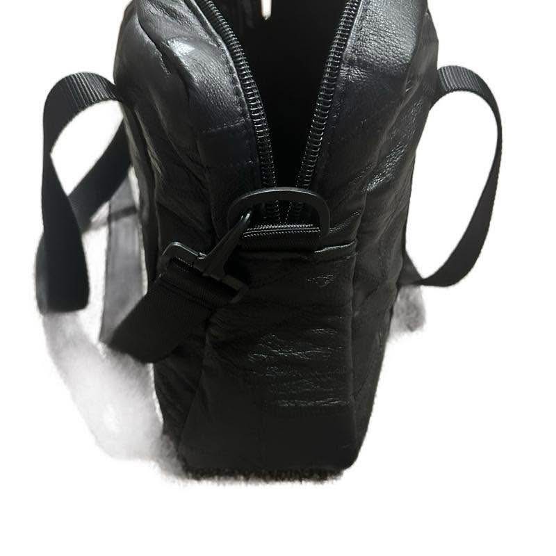 Black Leather Shoulder Bag with Reflective Stripes and Adjustable Straps.