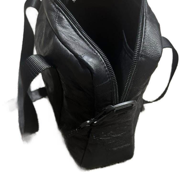 Black Leather Shoulder Bag with Reflective Stripes and Adjustable Straps.